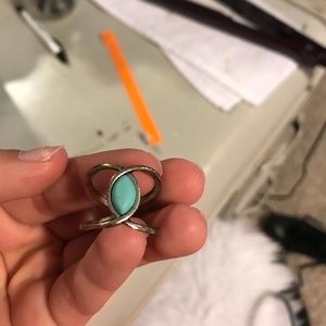 Ring with blue piece in middle